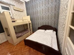 Postel nebo postele na pokoji v ubytování KM Hostel and Tourism