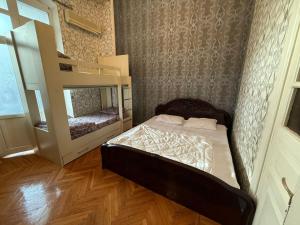 Postel nebo postele na pokoji v ubytování KM Hostel and Tourism