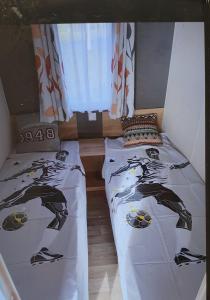 Postel nebo postele na pokoji v ubytování Camping Oasis Middelkerke Romy 1, 2, 3, 4