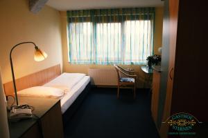 Postel nebo postele na pokoji v ubytování Hotel Gasthof Sternen