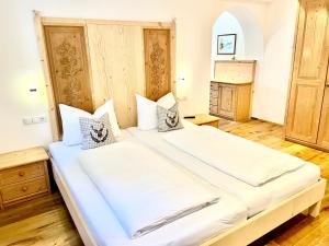 Posteľ alebo postele v izbe v ubytovaní Chalet Bernardi Apartments