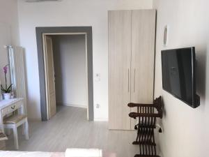 TV a/nebo společenská místnost v ubytování La Tana Dei Leoni Affittacamere