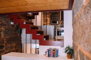 a staircase in the kitchen of a house at A 5 min de las Playas de Cangas by CABANA Rentals in Cangas de Morrazo