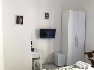 TV a/nebo společenská místnost v ubytování La Tana Dei Leoni Affittacamere