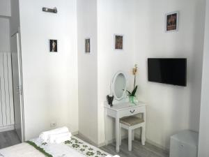 TV a/nebo společenská místnost v ubytování La Tana Dei Leoni Affittacamere