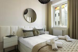 Ένα ή περισσότερα κρεβάτια σε δωμάτιο στο Elite Apartments Aura Old Town