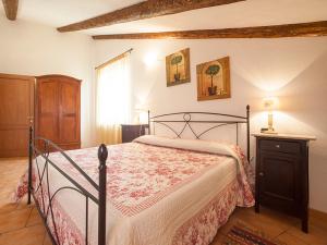 a bedroom with a bed in a room at Agriturismo La Cantina in Farigliano