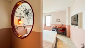 Letto o letti in una camera di Kotta GO Hotel Tegal