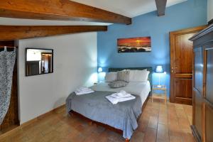 Postel nebo postele na pokoji v ubytování Borgo Faldo - Bilocale con Cucina - 116 + 2 fotografie