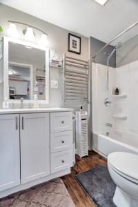 a bathroom with a sink and a toilet and a tub at Cheerful 2-Bedroom with convenient Expressway access in Springfield