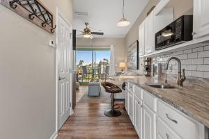 a kitchen with a sink and a counter top at Inn at Seacrest 309- Somewhere in the Sun in Inlet Beach