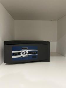 a microwave oven sitting on a counter in a room at MILA by The Blue Twins apartments Milano in Milan