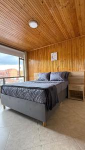 Postel nebo postele na pokoji v ubytování Hostelfc Movistar57