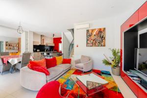 a living room with a couch and a table at Moun Oustau in Avignon