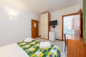 Posteľ alebo postele v izbe v ubytovaní Hotel New Aurora Venice