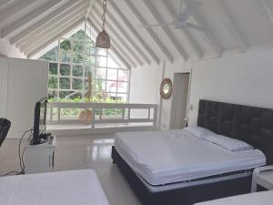 Postel nebo postele na pokoji v ubytování San Marcos Villa Mesa