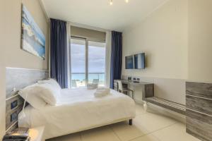 Letto o letti in una camera di Hotel Belvedere