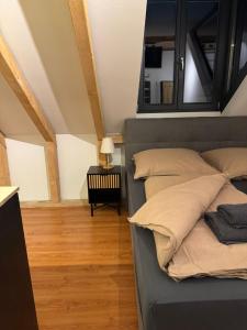 a bedroom with a bed with pillows on it at Modernes und helles Apartment VS in Villingen-Schwenningen