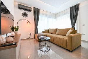 a living room with a couch and a table at Holiday home San Antonio in Bibinje