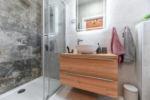 a bathroom with a sink and a shower at Holiday home San Antonio in Bibinje +69 photos