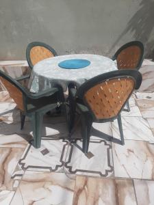 a metal table with two chairs around it at Casa Tota in Assomada +41 photos
