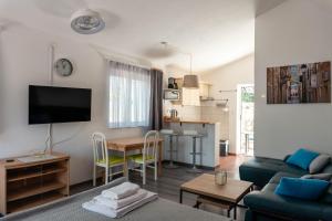 a living room with a couch and a table at Villa Vujeva in Pag
