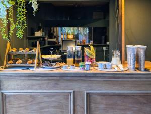 a buffet with food on top of a table at The Abbey Residence in Edinburgh