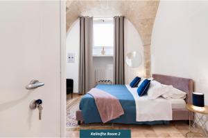 Postel nebo postele na pokoji v ubytování Kalinifta - Lecce Selection
