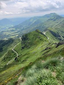 a view of a mountain with a road on it at Les Nuits de Vieillespeze in Saint-Projet-de-Salers