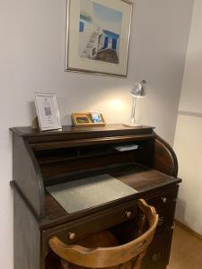 a wooden desk with a lamp on top of it at Black Forest Oase in Gaggenau +34 photos