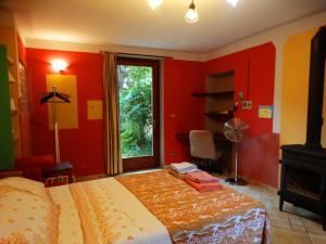 Un pat sau paturi într-o cameră la Agriturismo Casa de Colores