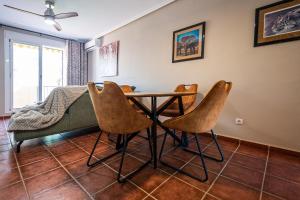 a dining room with a table and chairs at Parque Vera 5 in Vera