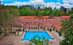 an aerial view of a large house with a swimming pool at Apartment house close to Bojnice in Prievidza