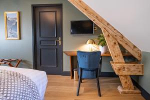Posteľ alebo postele v izbe v ubytovaní Hôtel du cirque et de la cascade