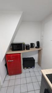 a kitchen with a counter with a microwave on it at FeWo EssensStube - Gemütlich - Geräumig - Gut in Essen +2 photos
