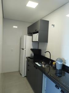 Η κουζίνα ή μικρή κουζίνα στο Apartamento em São Lourenço