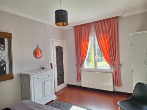 a bedroom with red curtains and a window at Gîte du Canal de Berry II Beauval 6 personnes in Selles-sur-Cher +24 photos