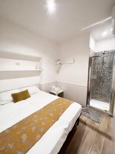 a bedroom with a large bed and a window at Residenza San Biagio in Naples +177 photos