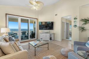 a living room with a couch and a table at 301 West in Gulf Highlands