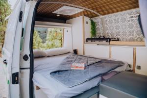 a bed in the back of a camper van at Camper La Guancha in San Sebastián de la Gomera