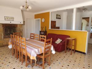 a living room with a table and a couch at Chambres d'hôtes Gaffes in Saubrigues