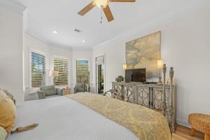 a bedroom with a bed and a ceiling fan at Blue Bayou in Gulf Highlands +58 photos
