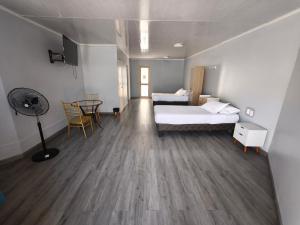 Ένα ή περισσότερα κρεβάτια σε δωμάτιο στο Hotel Flamingo