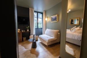 Posteľ alebo postele v izbe v ubytovaní Hôtel du cirque et de la cascade