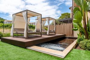 Сад в Villa Cosy, hotel & spa
