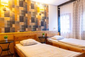 Posteľ alebo postele v izbe v ubytovaní Hostel Orange