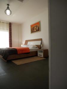 a bedroom with a large bed and a window at Résidence Bambou in Dakar +29 photos