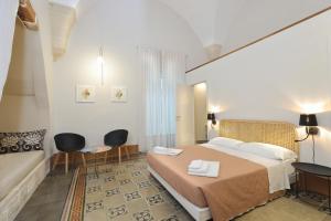 Postel nebo postele na pokoji v ubytování Palazzo Circolone + 37 fotografií