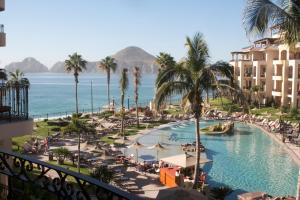 a view of a resort with a pool and the ocean at Villa La Estancia in Cabo San Lucas