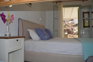 Postel nebo postele na pokoji v ubytování Klados Studios & Apartments